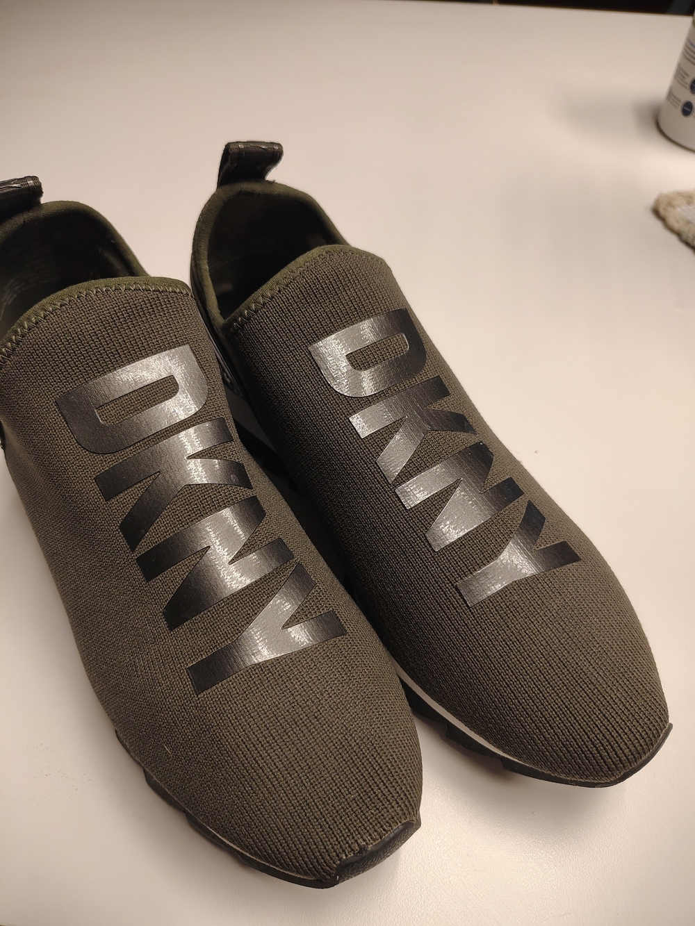 DKNY Women's Abbi Knit Slip-On Sneakers in an olive green colorway